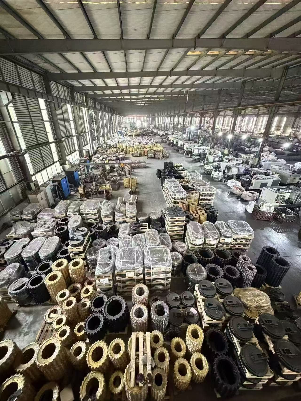 FY Machinery warehouse with stored undercarriage parts